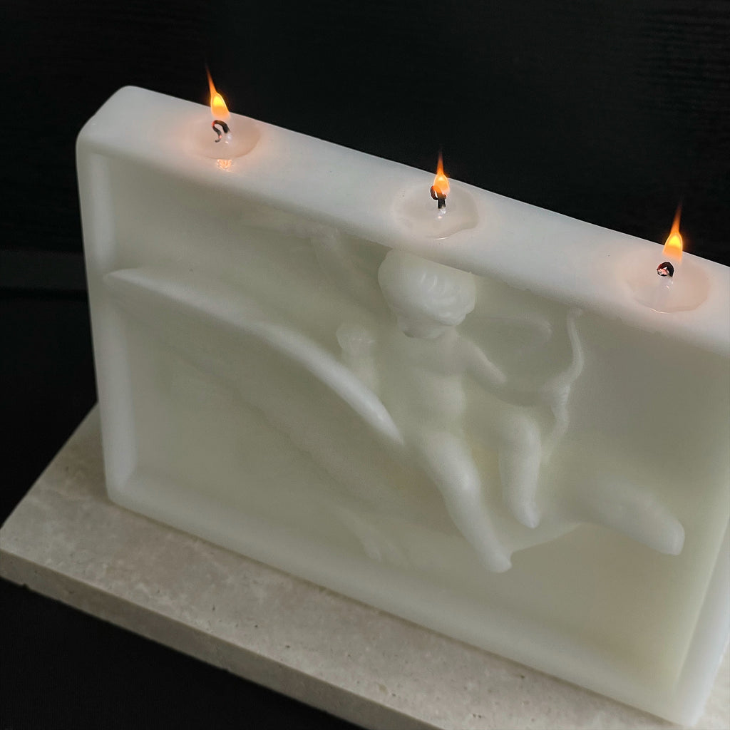 ingo | "Cupid on the Dolphin" Bas-Relief Sculpture Candle – Heavyweight Marble Base Scented Art Piece