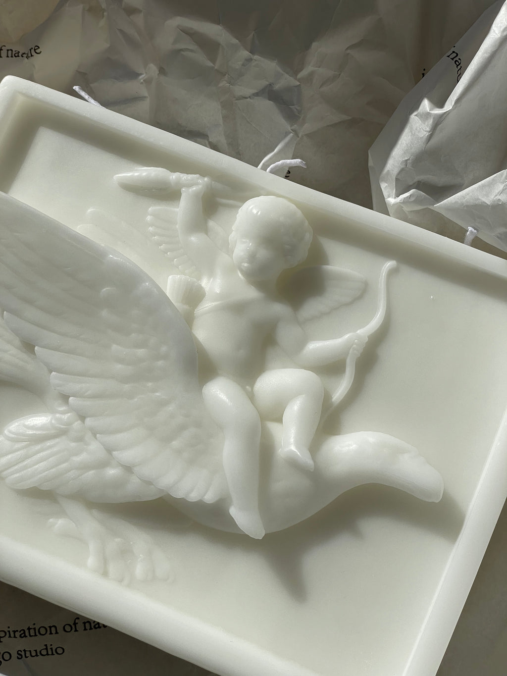ingo | "Cupid on the Dolphin" Bas-Relief Sculpture Candle – Heavyweight Marble Base Scented Art Piece